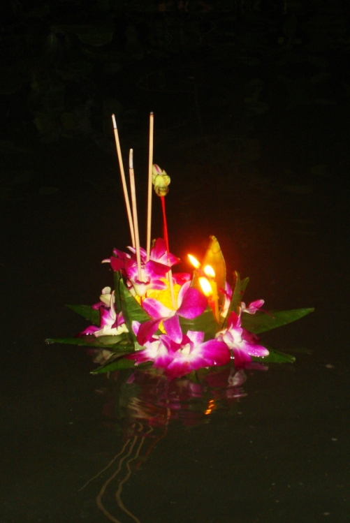 Floating our kratong in the bioluminescent bay